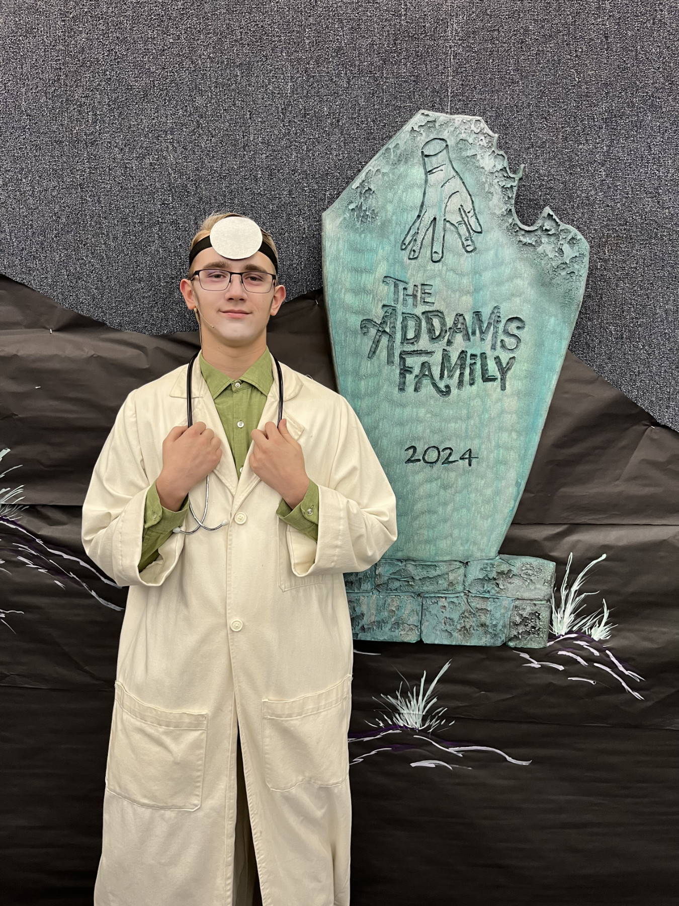 Eli as a doctor in the Addams Family.